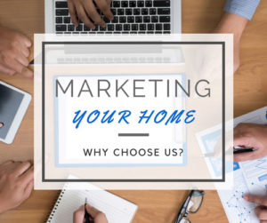People gathered at table with clipboard, notebook, computer, glasses, and tablet with a white overlay that reads 'Marketing your home: why choose us' on top